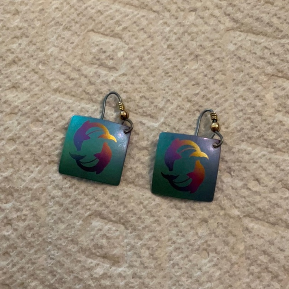 Multi color metallic earrings with dolphins. Excellent condition!!